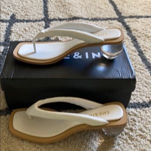 Mules with transparent round chunky heel.